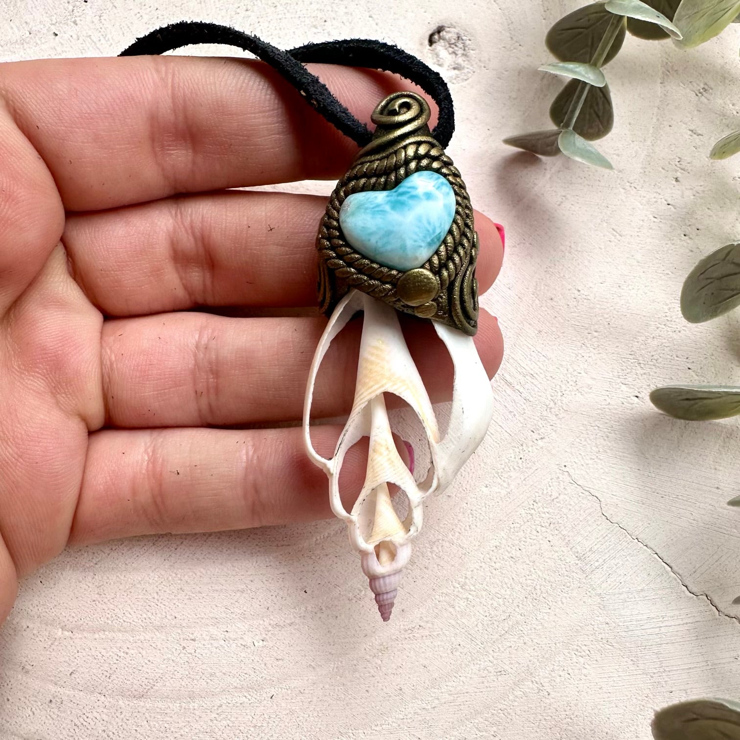 Ocean inspired crystal jewelry featuring Larimar Heart and seashell pendant