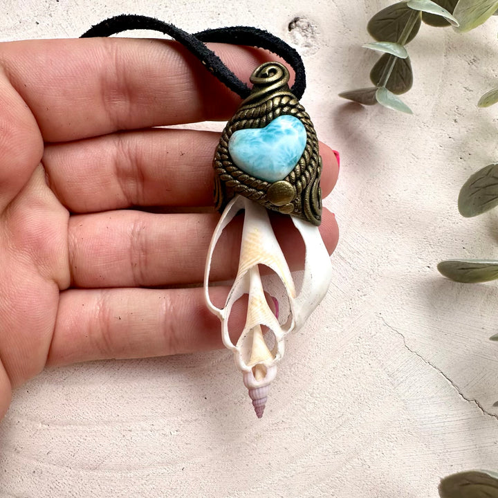 Ocean inspired crystal jewelry featuring Larimar Heart and seashell pendant