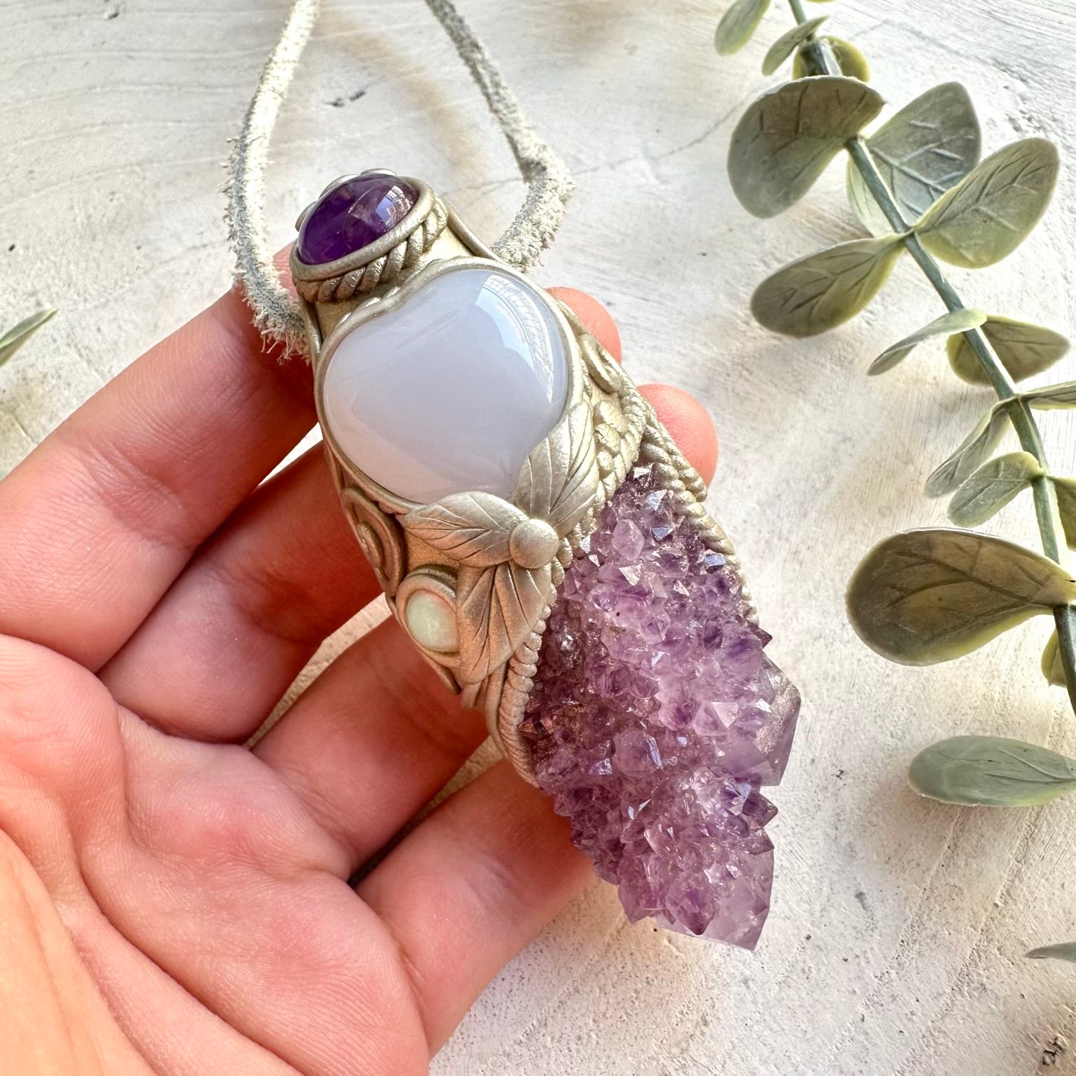 One of a kind healing crystal wand with sparkling Spirit Quartz and a heart-shaped Blue Chalcedony gemstone.
