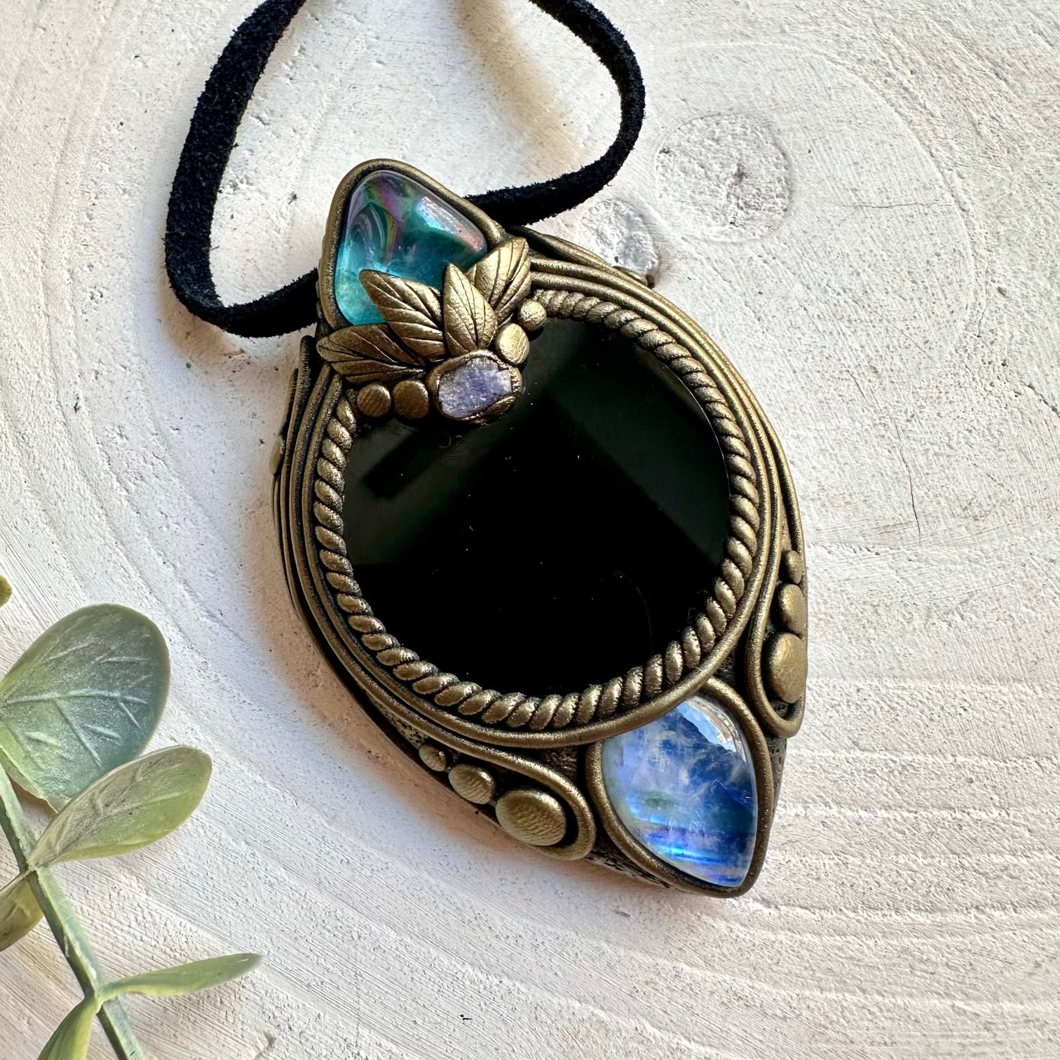 Artisan handmade pendant featuring Black Obsidian Mirror, Rainbow Moonstone and a raw Tanzanite gemstone.