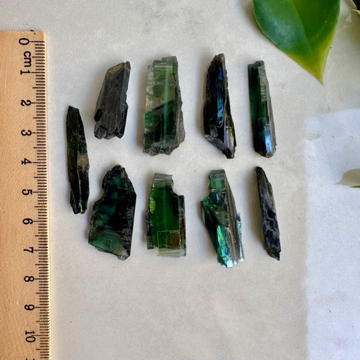 Mineral samples with a ruler on a light background