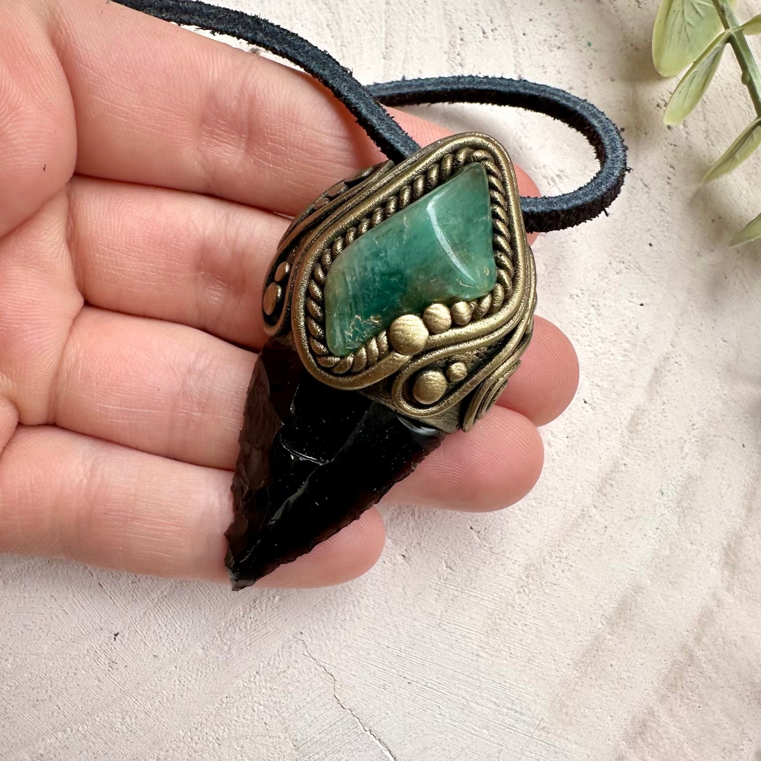 Handmade obsidian arrowhead necklace with emerald gemstone