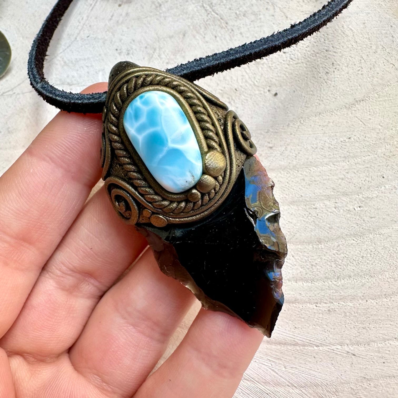 Handmade necklace with black obsidian arrowhead and larimar