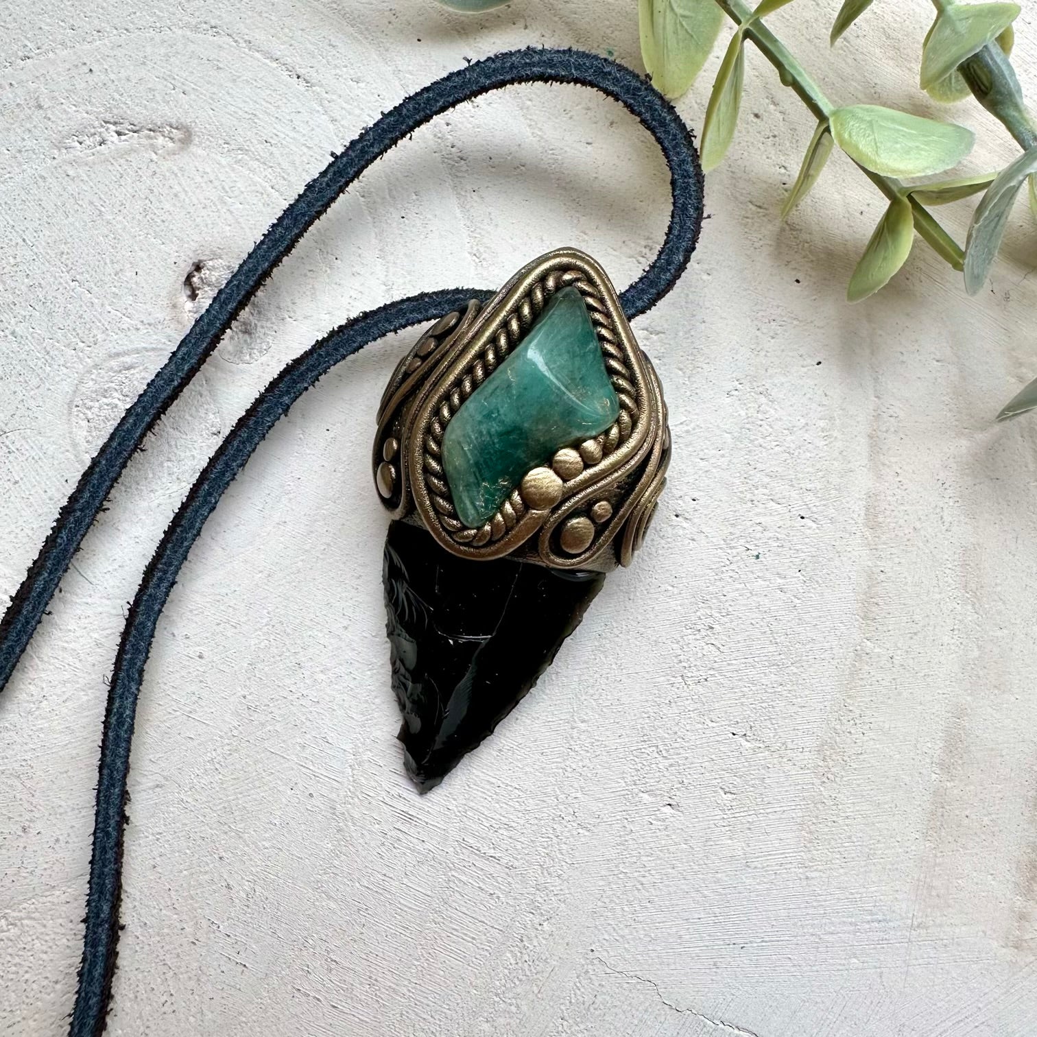 Energy pendant with obsidian arrowhead and emerald