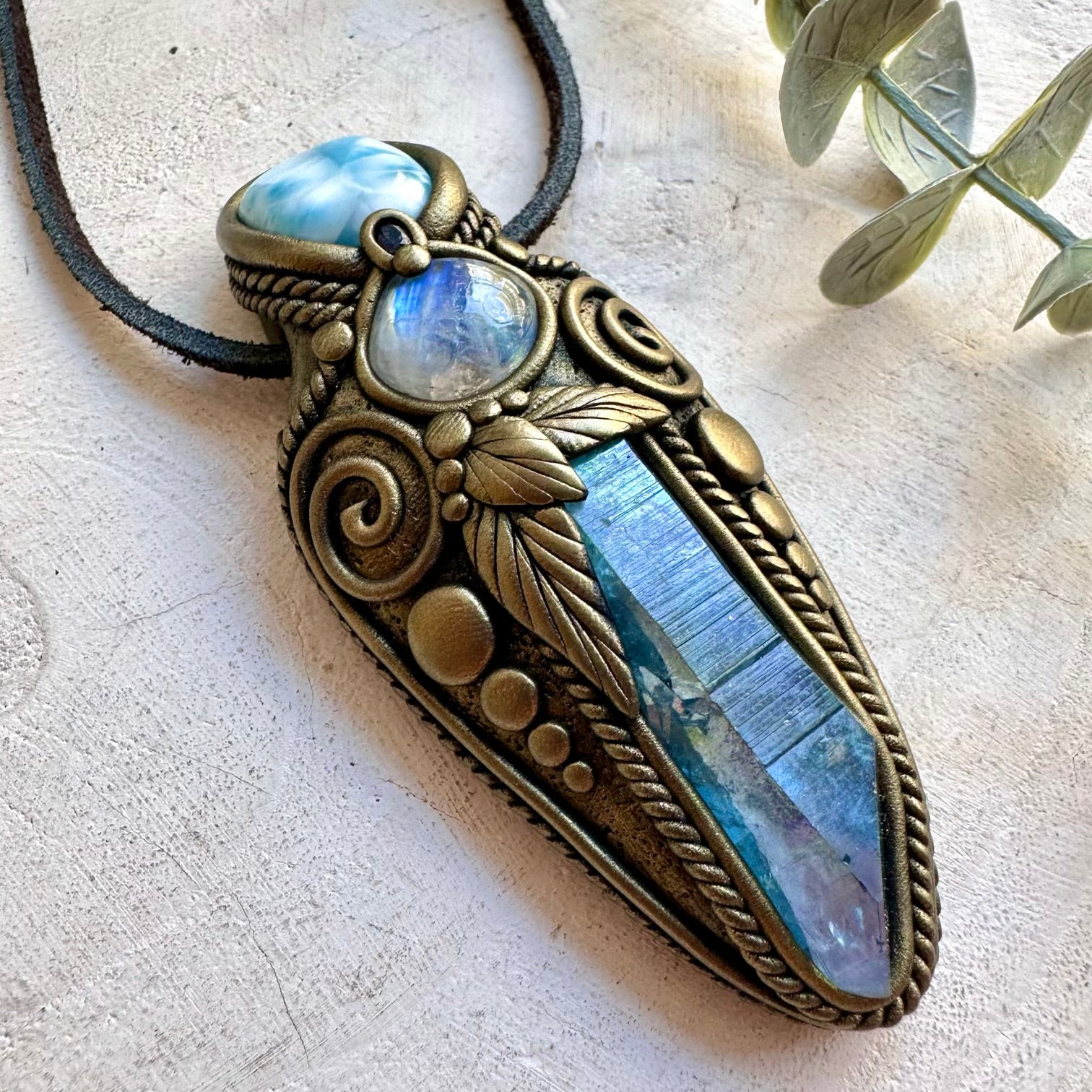 Handmade gemstone pendant combining Aqua Aura Quartz, Larimar and Rainbow Moonstone.