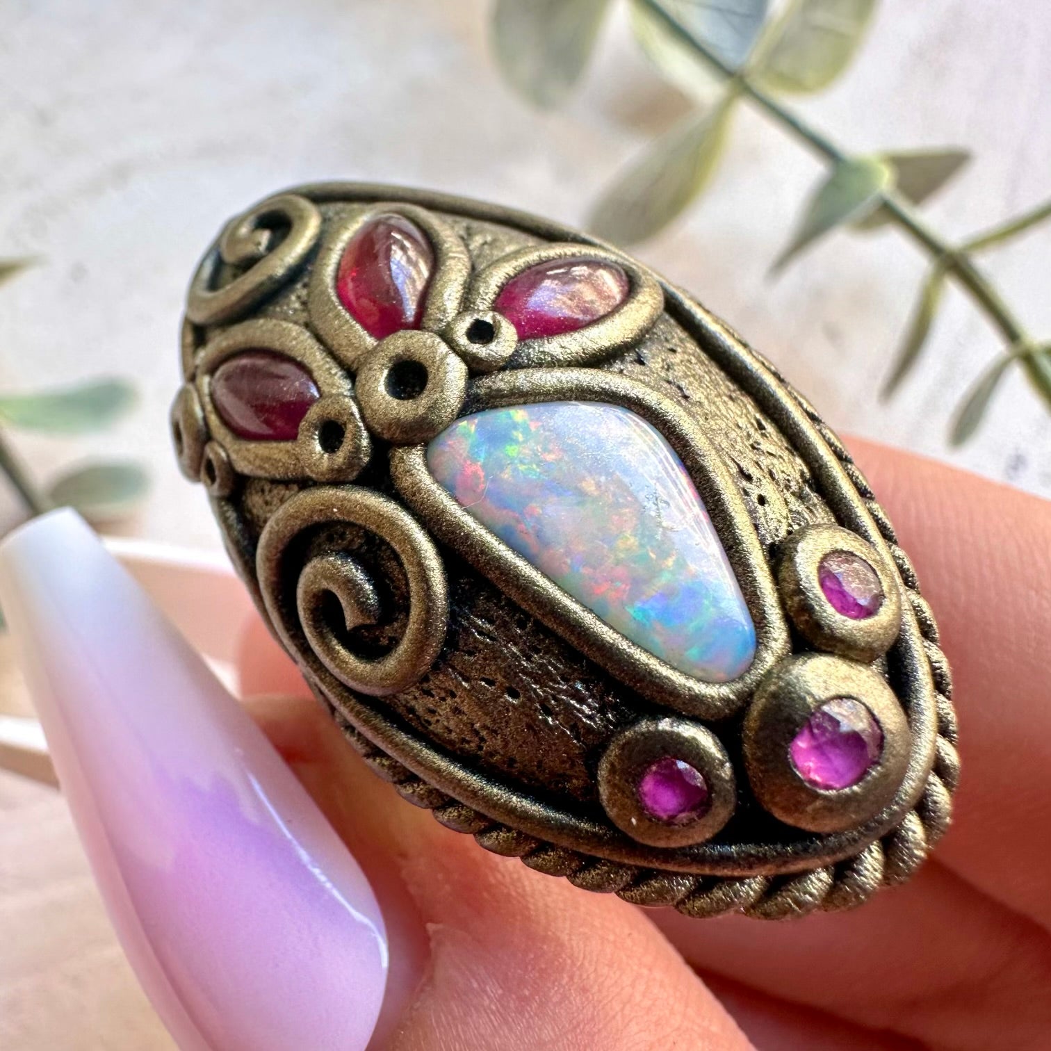 One of a kind Australian Opal ring with deep red Rhodolite Garnet and Ruby accents.