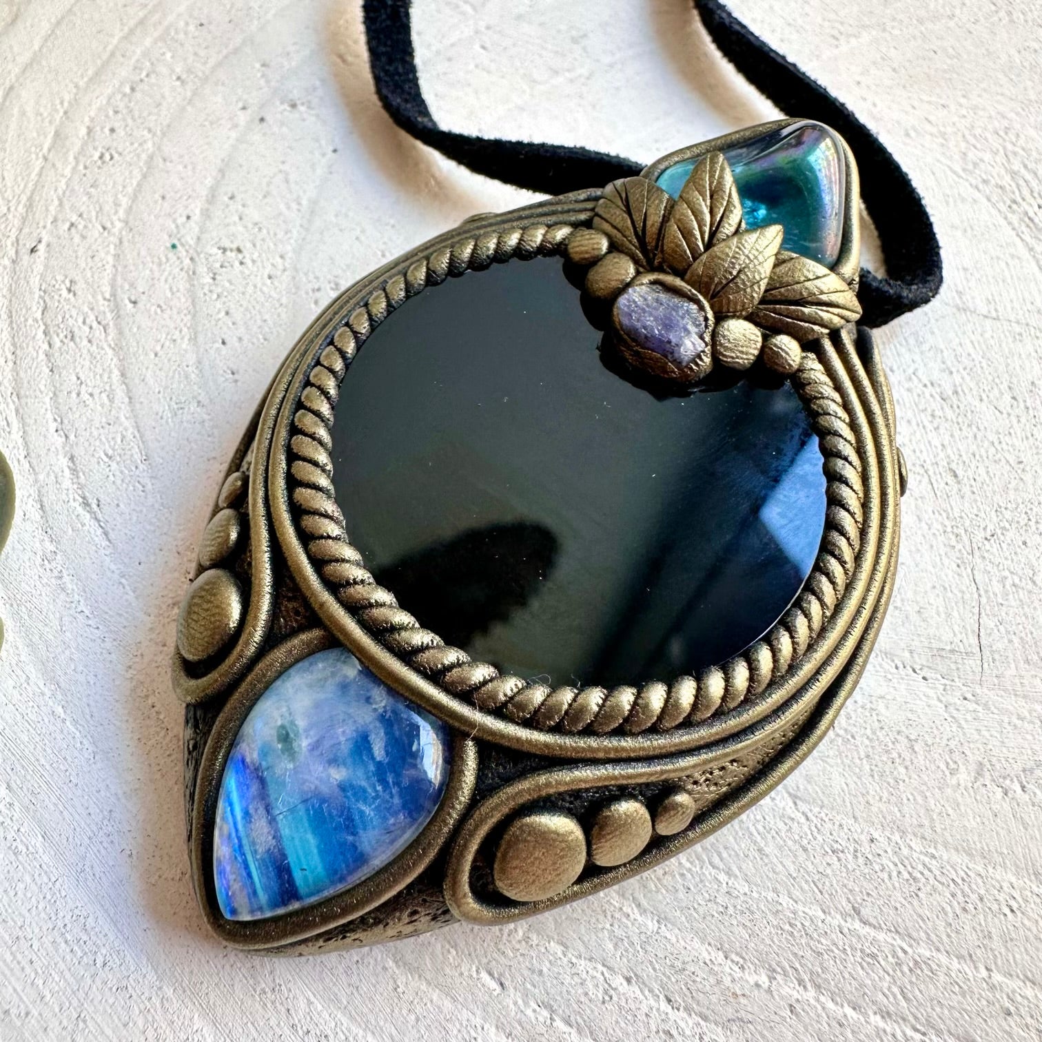 Handmade crystal jewelry with Aqua Aura Quartz, Rainbow Moonstone and Raw Tanzanite accents.
