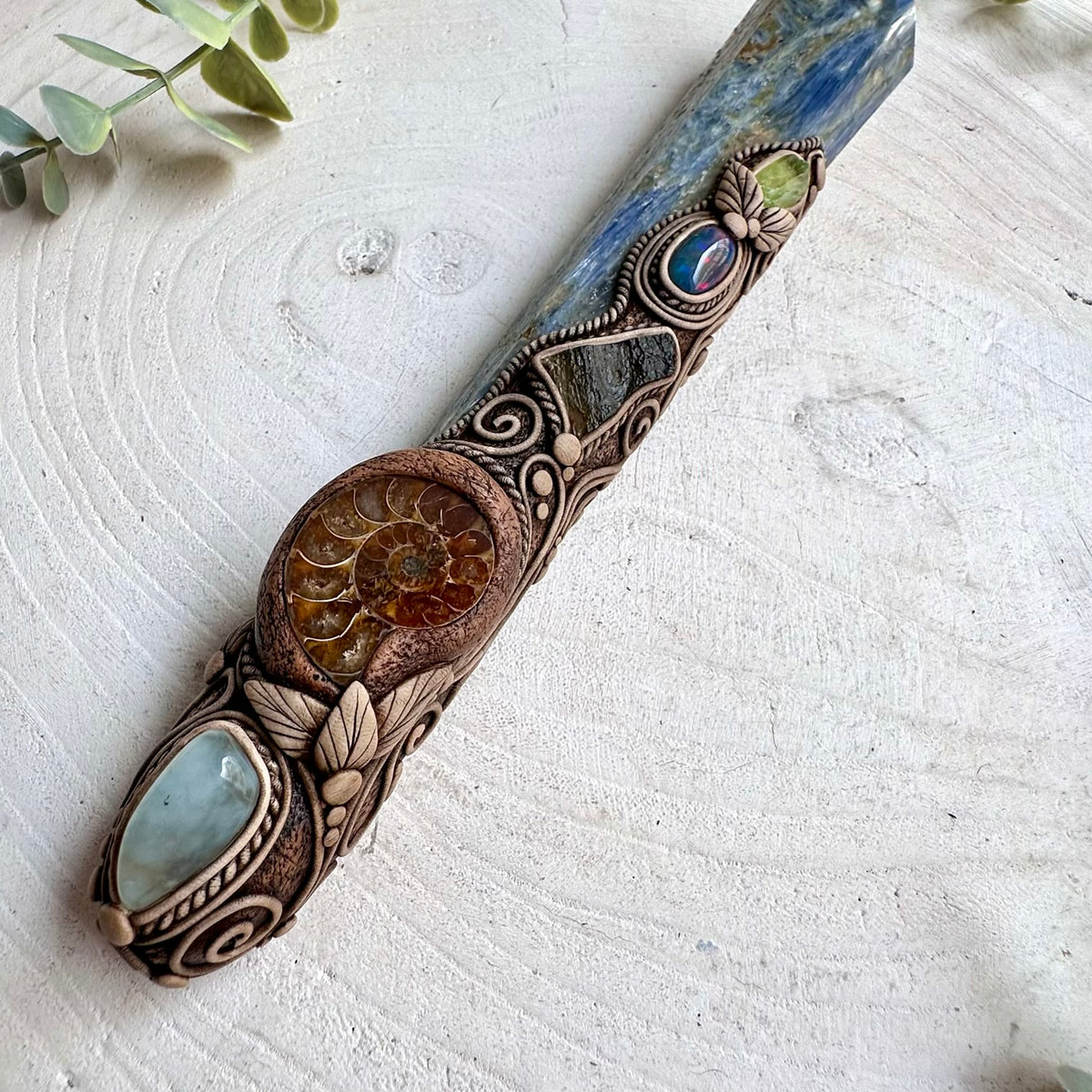 Blue Kyanite crystal wand decorated with Aquamarine and Peridot, traditionally associated with clarity, calmness and spiritual awareness.