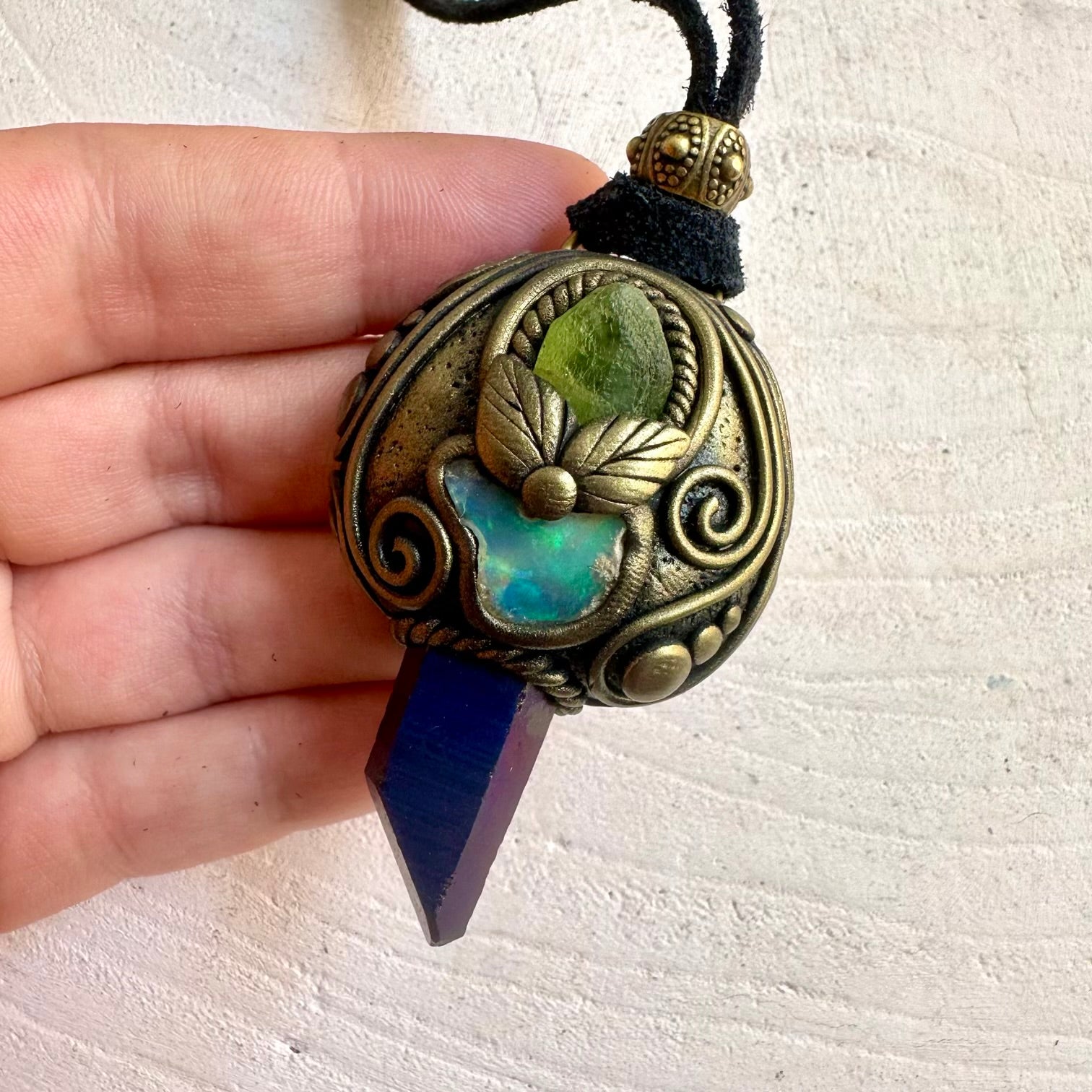 Natural gemstone jewelry showcasing shimmering Cobalt Aura Quartz and a unique Raw Ethiopian Opal.