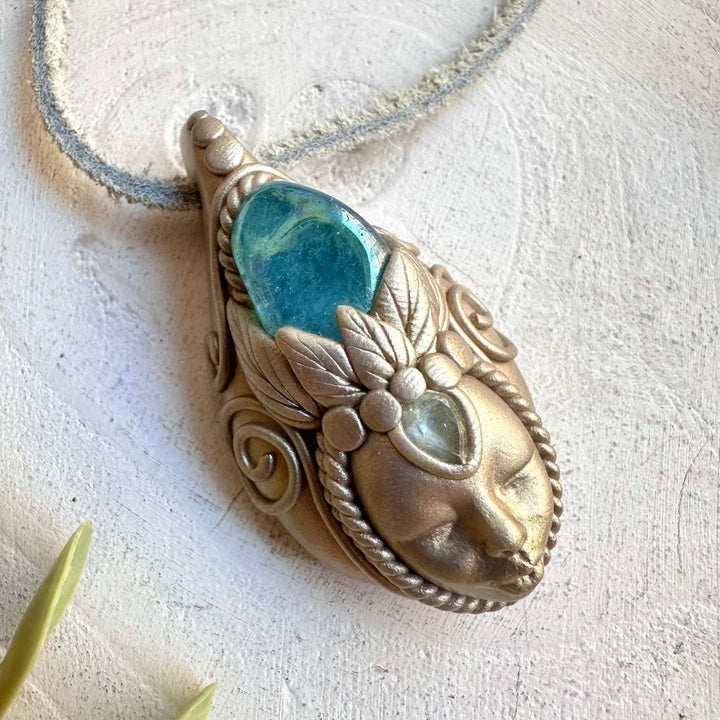 Protection amulet crystal necklace with aqua aura and blue topaz gemstones