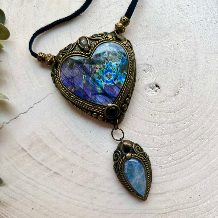 Boho gemstone pendant featuring a large Purple Labradorite heart with Rainbow Moonstone and Amethyst.