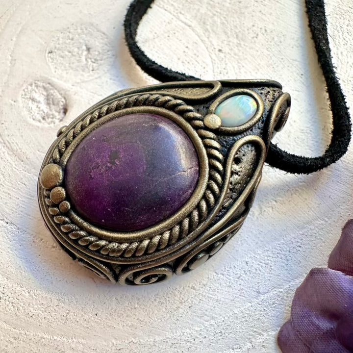 Unisex metaphysical healing crystal necklace featuring natural imperfect purple Purpurite and Australian Opal amulet pendant.