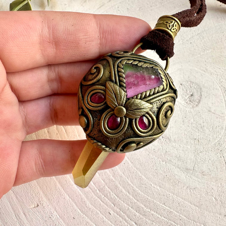 One of a kind crystal necklace featuring glowing Sunset Aura Quartz and colorful Watermelon Tourmaline.