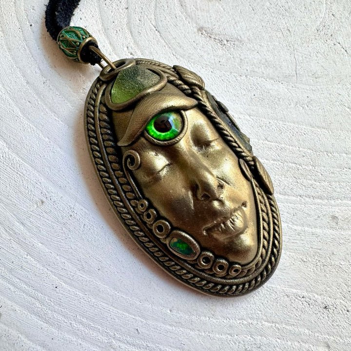 Artisan pendant necklace showcasing Peridot, Moldavite and Black Ethiopian Opal in a mystical design.