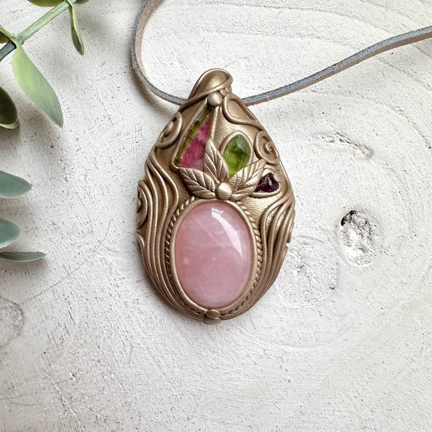 Watermelon tourmaline paired with peridot and garnet in a necklace