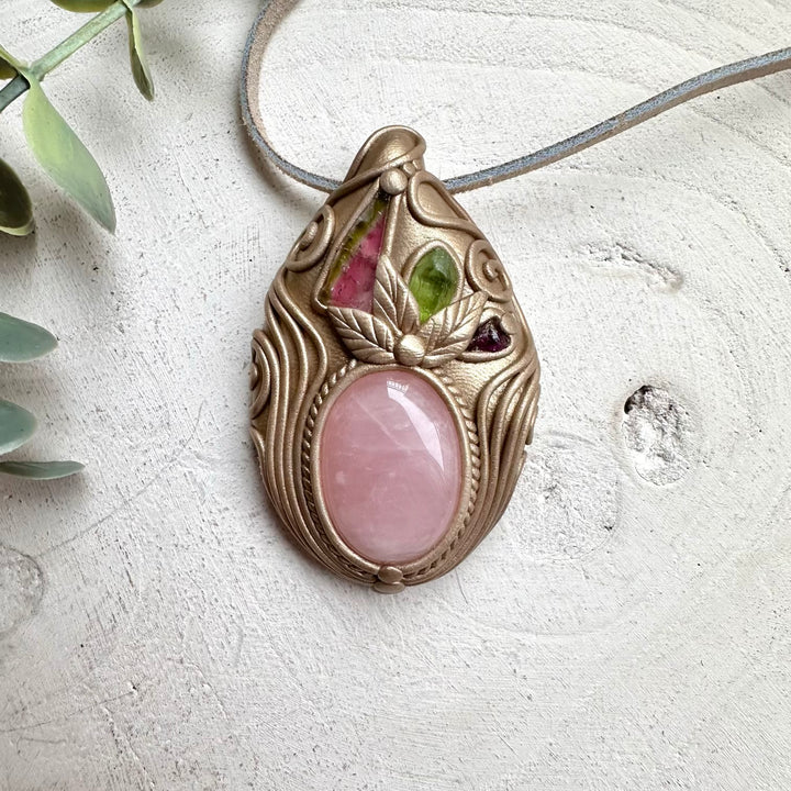 Watermelon tourmaline paired with peridot and garnet in a necklace