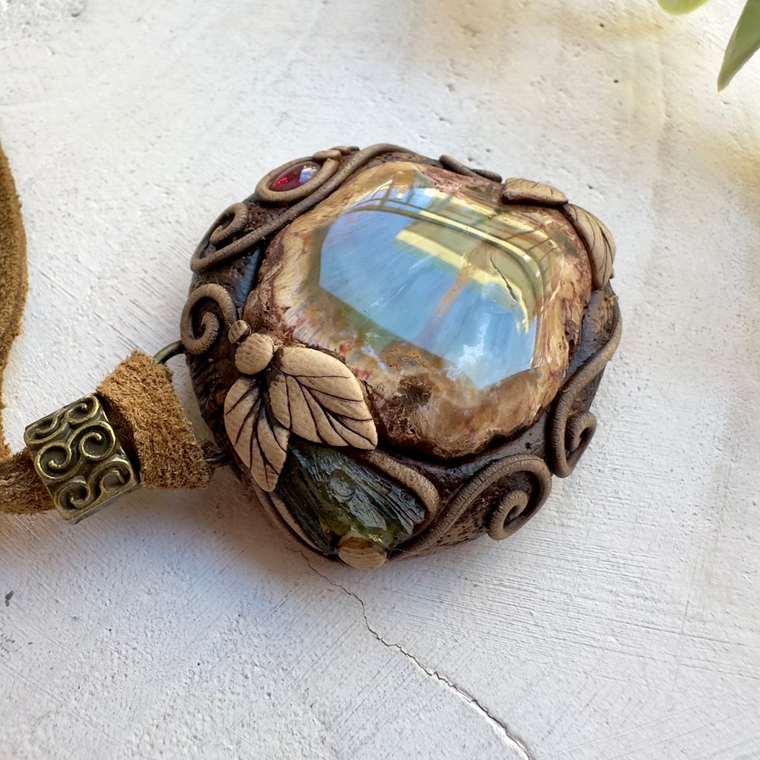 Spiritual jewelry combining petrified wood and rhodolite garnet
