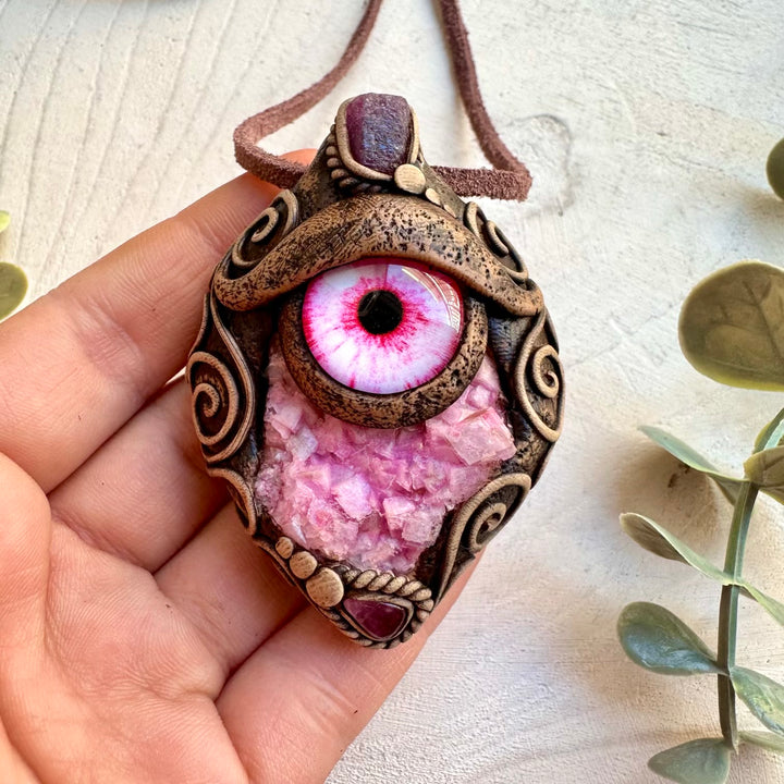 Handmade necklace featuring pink calcite cluster and ruby