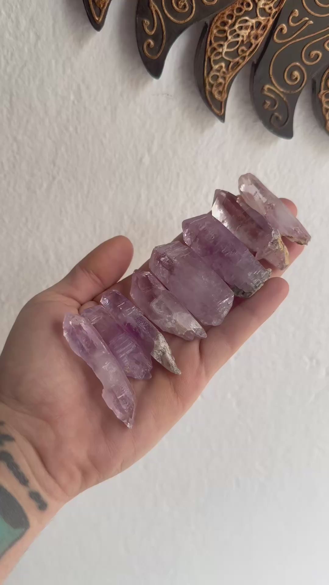 Hand holding a collection of Healing crystal points – Vera Cruz Amethysts