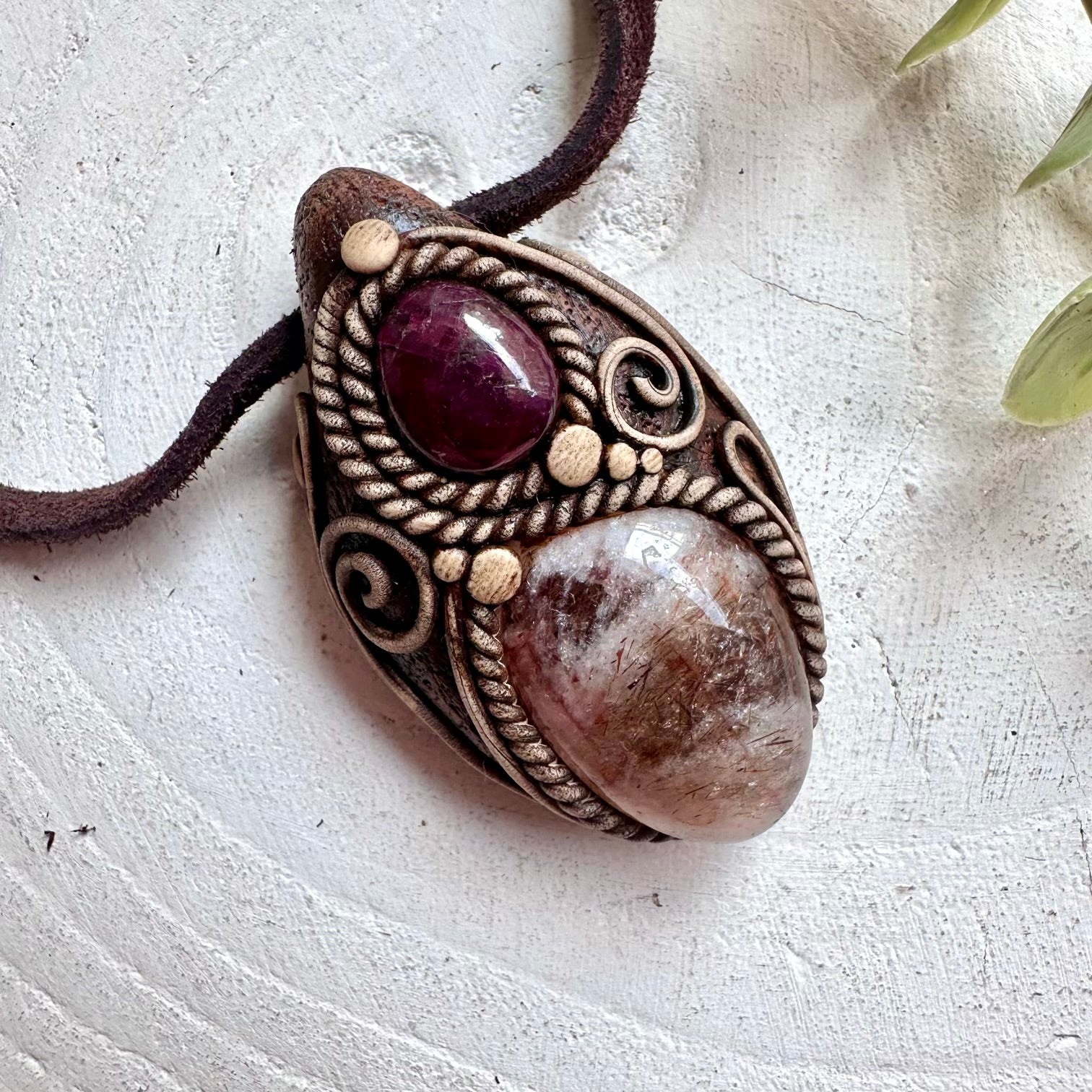 Healing stone necklace featuring Hematite Quartz and Ruby pendant