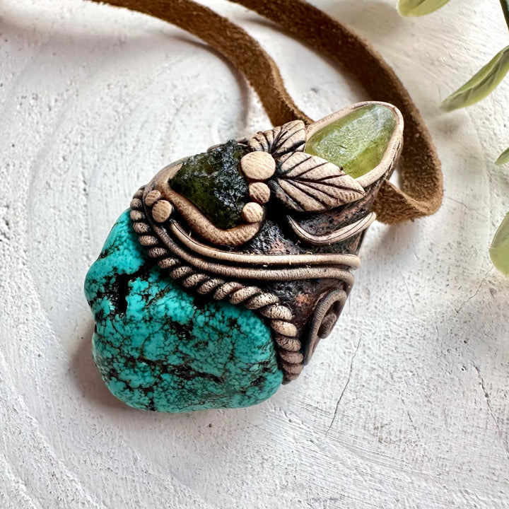 Unisex crystal pendant necklace with Moldavite, Turquoise and Peridot for spiritual jewelry lovers