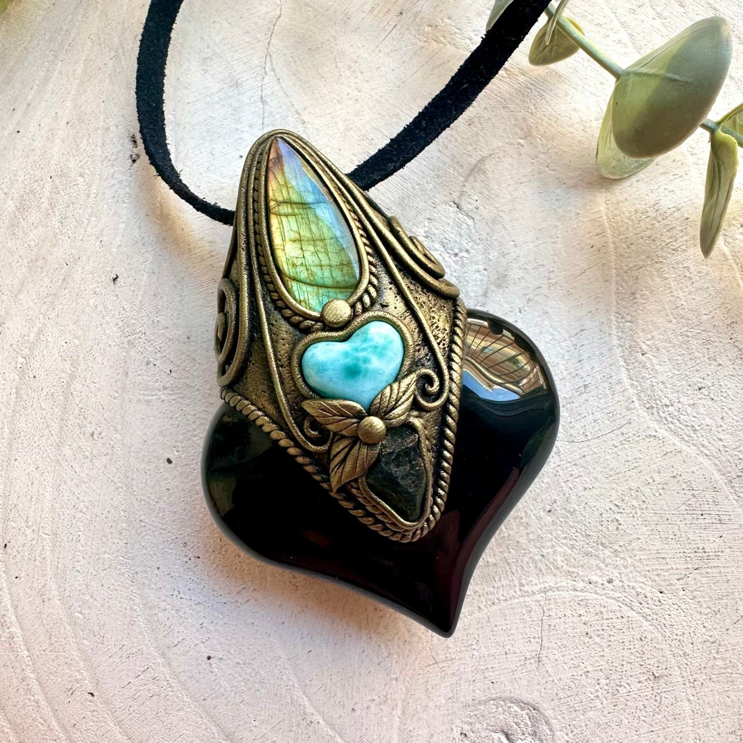 One of a kind gemstone necklace handcrafted with Rainbow Obsidian and a beautiful Larimar heart.