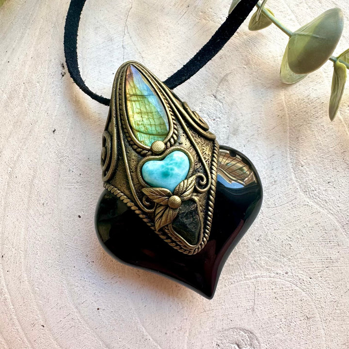 One of a kind gemstone necklace handcrafted with Rainbow Obsidian and a beautiful Larimar heart.