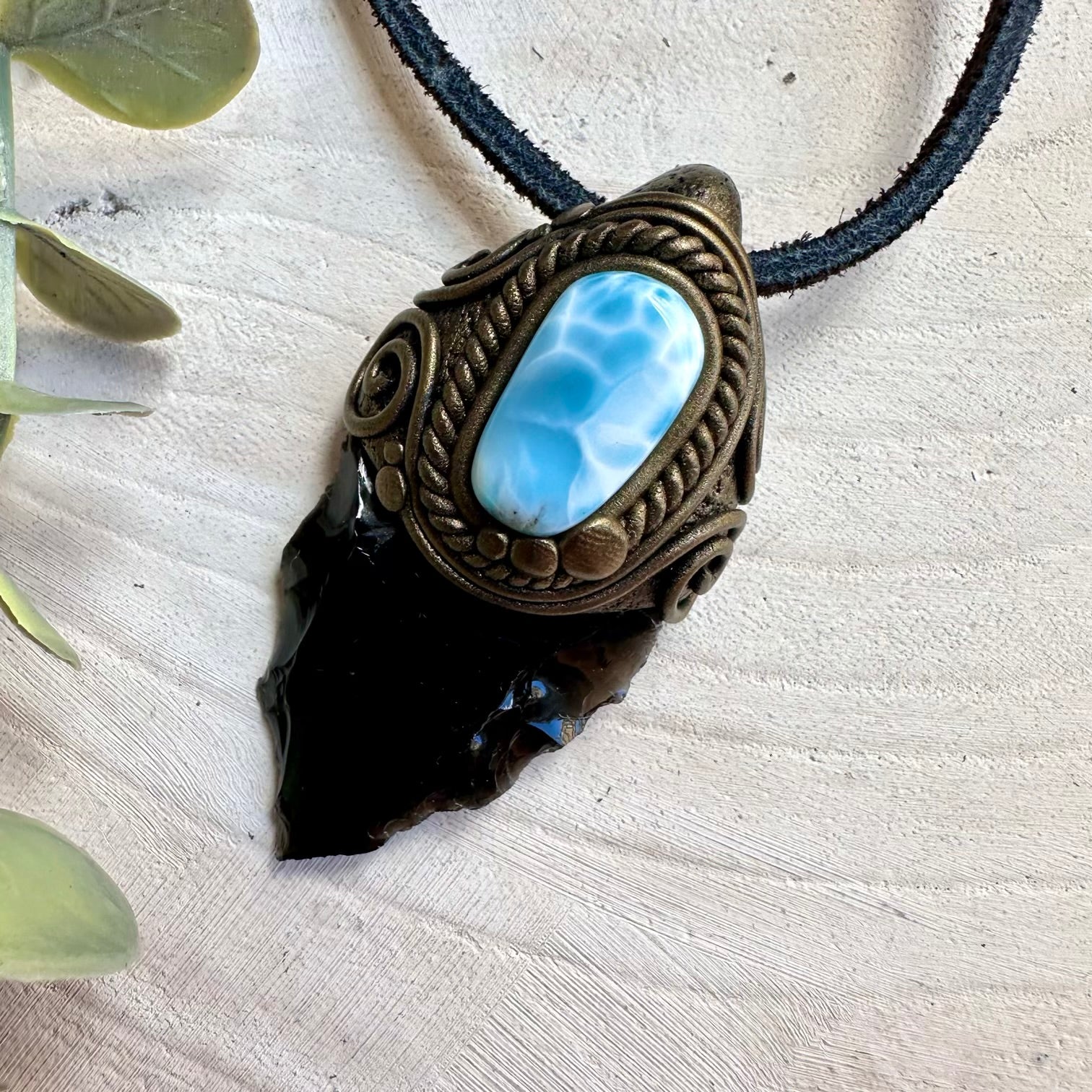 Spiritual jewelry combining obsidian and larimar