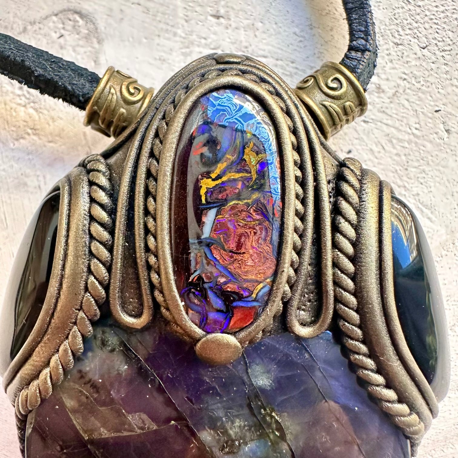 Unique gemstone necklace combining purple labradorite boulder opal and onyx