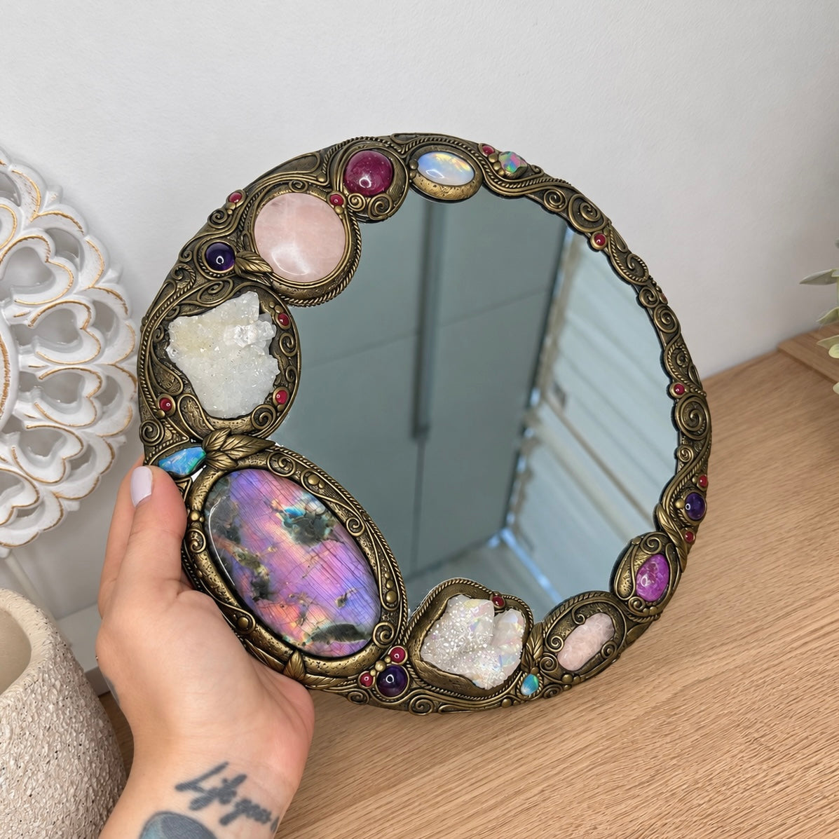Crystal mirror with Purple Labradorite, Apophyllite, Rose Quartz, Ruby, Rainbow Moonstone, Stichtite, Morganite, Angel Aura Quartz, Amethyst, Ethiopian Opal and Rhodolite Garnet.