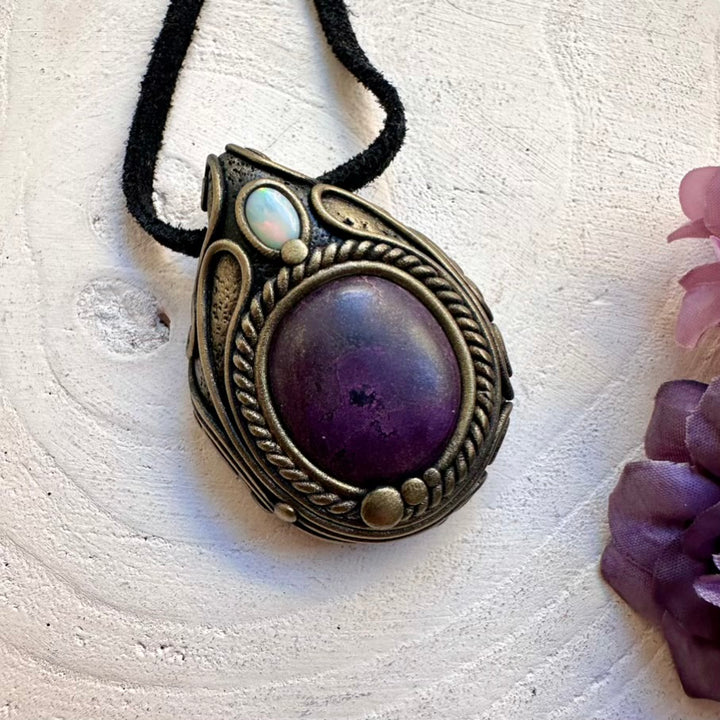 Handmade high-vibration healing crystal pendant necklace featuring rare Purpurite gemstone and Australian Opal flash.