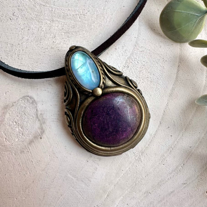 Handmade necklace featuring natural purpurite and rainbow moonstone crystals