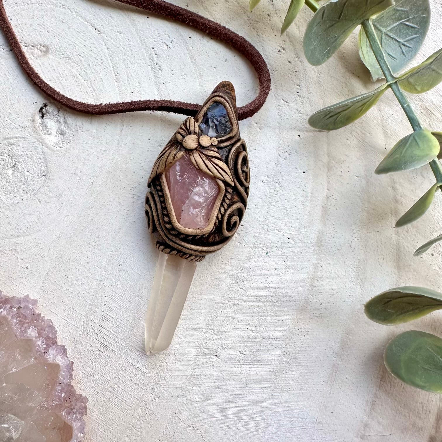 Lemurian quartz paired with rose quartz and tanzanite in a necklace