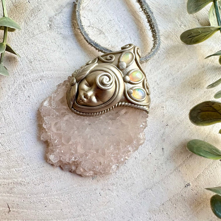Unique Goddess pendant combining a natural Quartz Stalactite Slice with iridescent Ethiopian Opal.