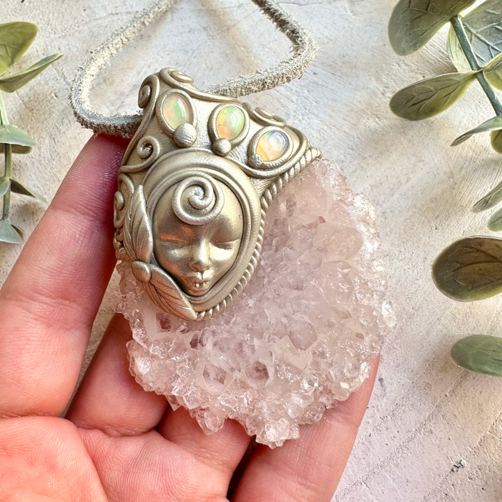 Handmade Quartz Stalactite Slice and Ethiopian Opal Goddess pendant necklace, a one of a kind spiritual gemstone jewelry piece combining a naturally formed Quartz formation with mesmerizing flashes of Ethiopian Opal. An enchanting metaphysical talisman that offers clarity, creativity, intuition, transformation and spiritual connection.