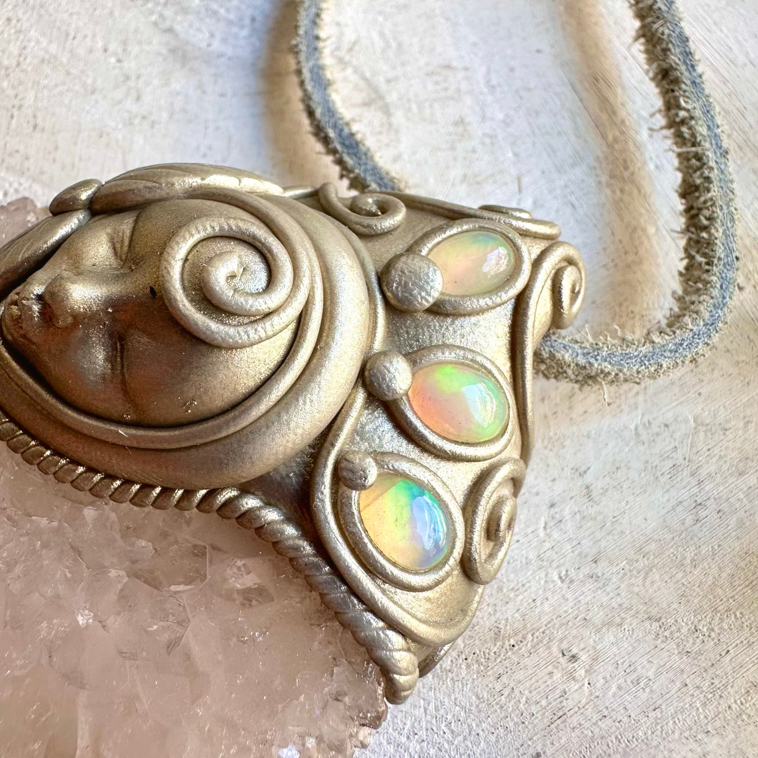 Handmade healing crystal jewelry featuring Quartz Stalactite and luminous Ethiopian Opal.