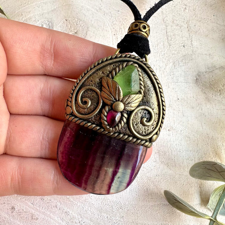 Unique crystal jewelry featuring naturally banded Rainbow Fluorite with vibrant green Peridot.