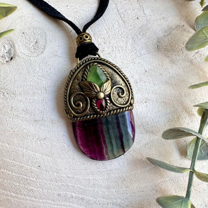 Unique handmade necklace with colorful Rainbow Fluorite, natural Peridot and rich red Garnet accents.
