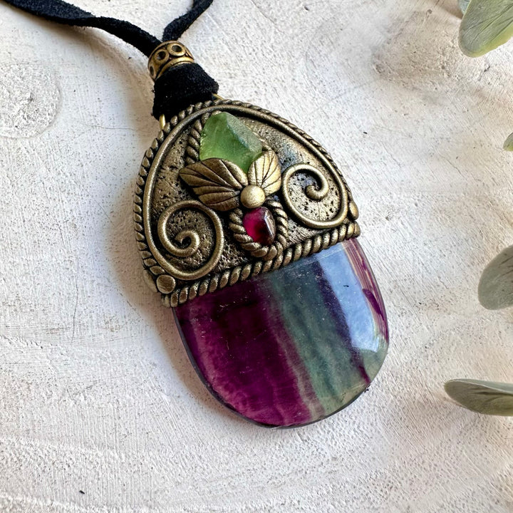 Handmade healing crystal jewelry showcasing Rainbow Fluorite with vibrant green and deep red gemstones.