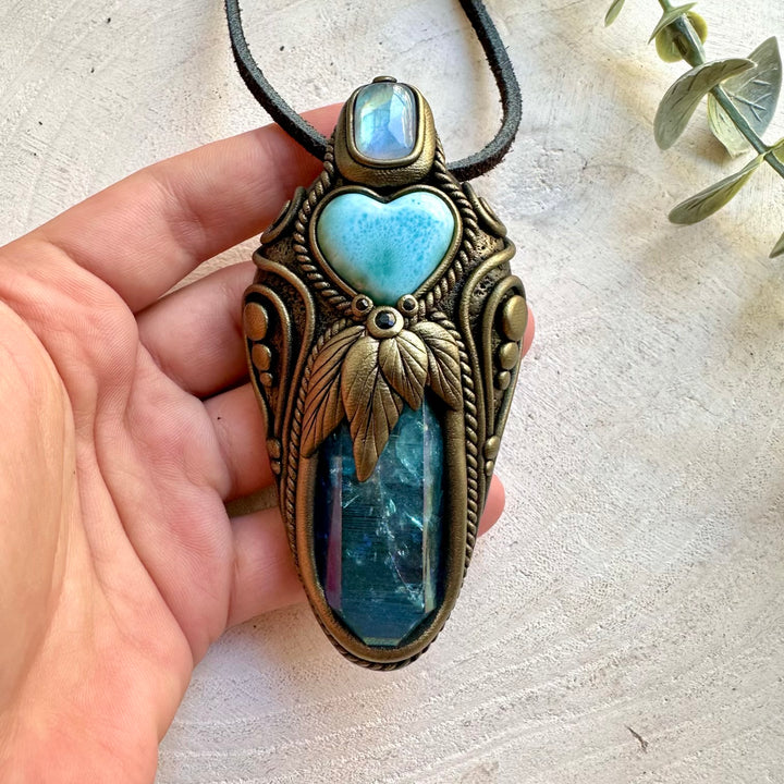 Handmade crystal jewelry combining Aqua Aura Quartz, Larimar Heart and iridescent Rainbow Moonstone.