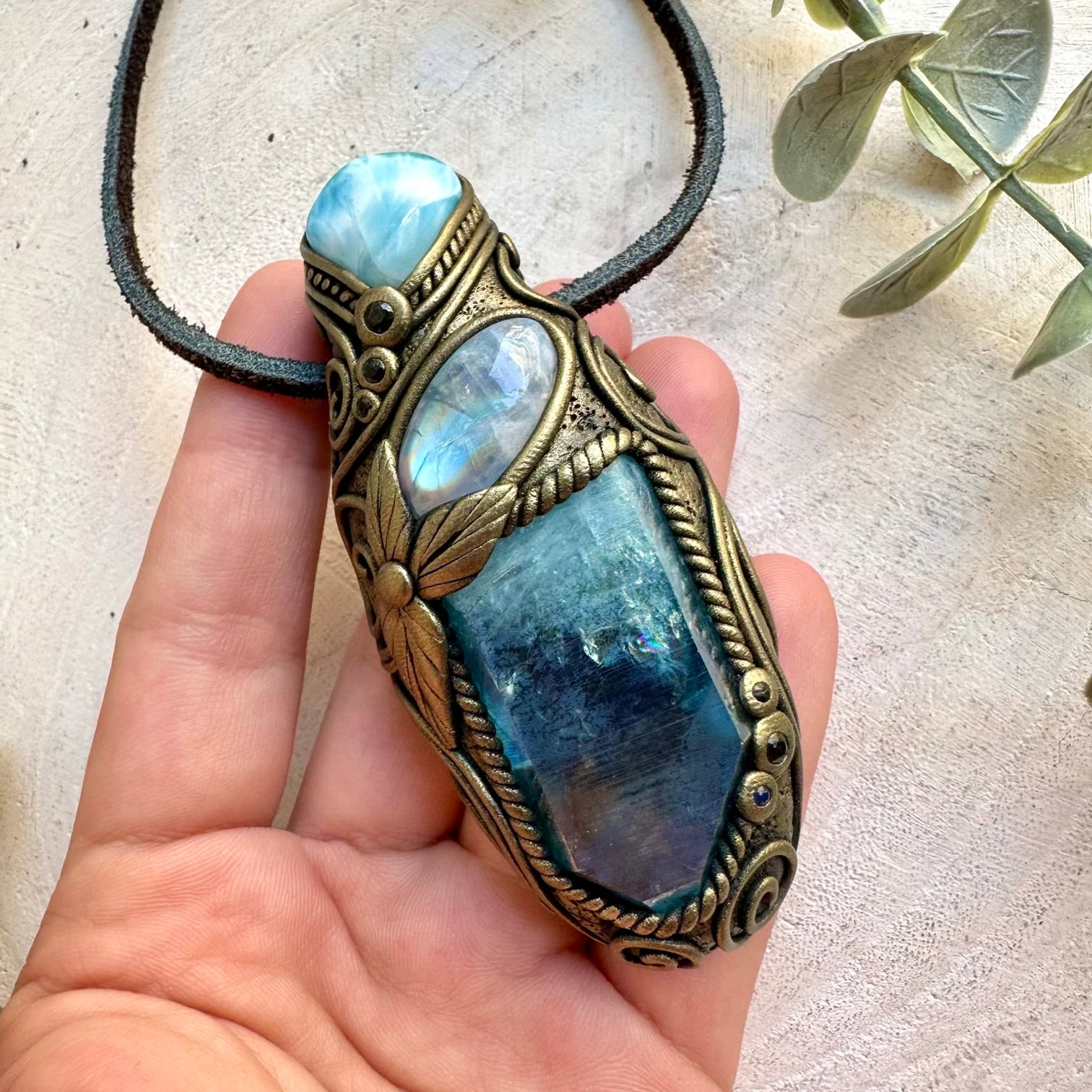 Unique enegy healing crystal necklace featuring shimmering Aqua Aura Quartz with iridescent Rainbow Moonstone.