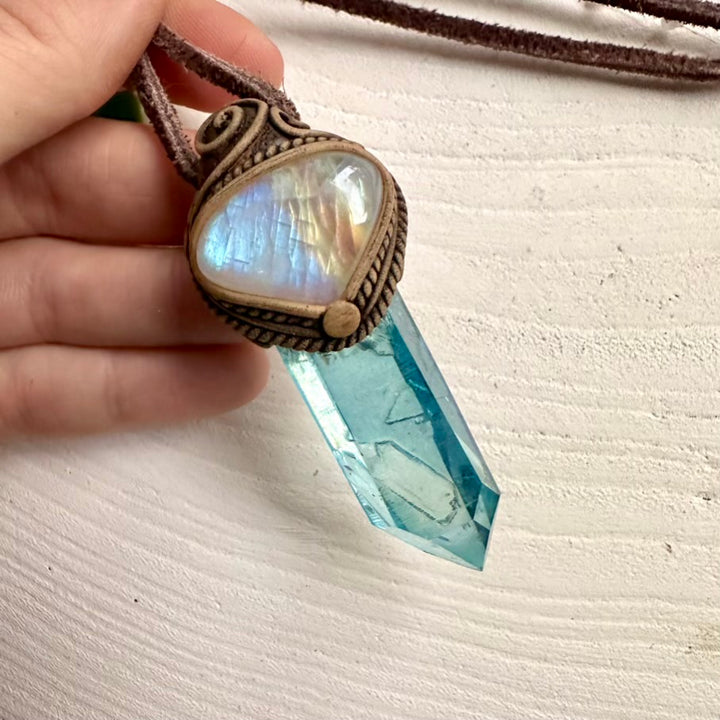 Aqua Aura Quartz crystal pendant paired with Rainbow Moonstone
