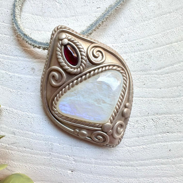 Crystal necklace with rainbow moonstone and rhodolite garnet gems