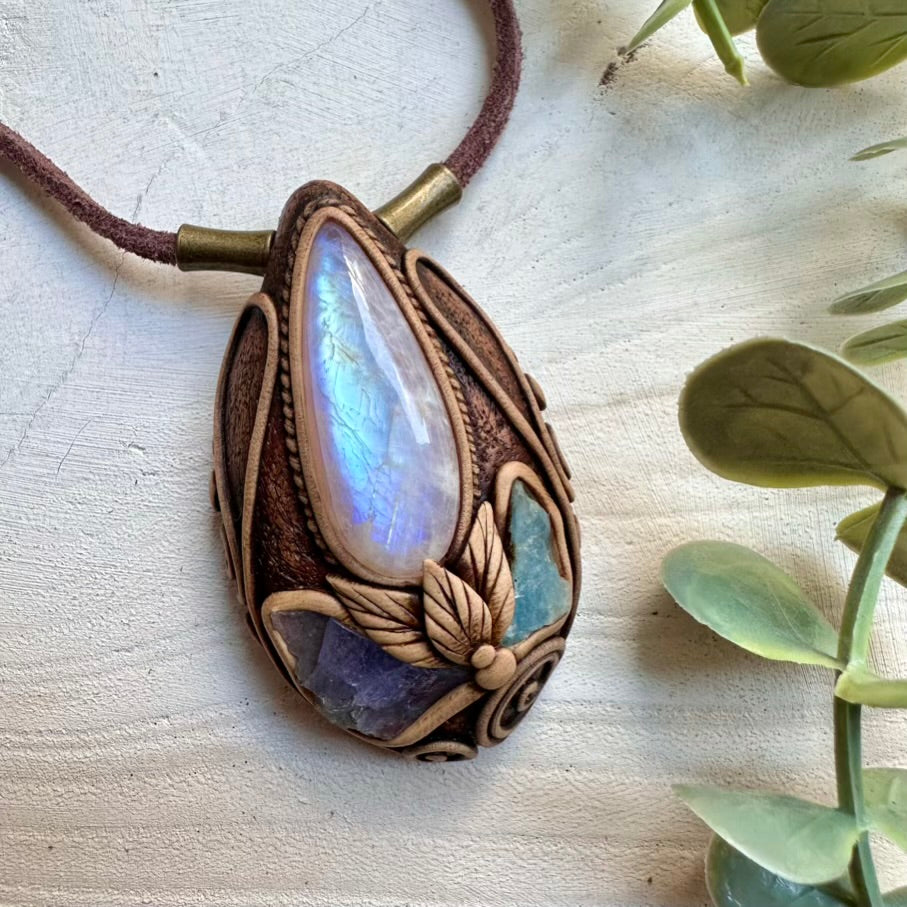 Boho jewelry pendant combining moonstone and raw tanzanite