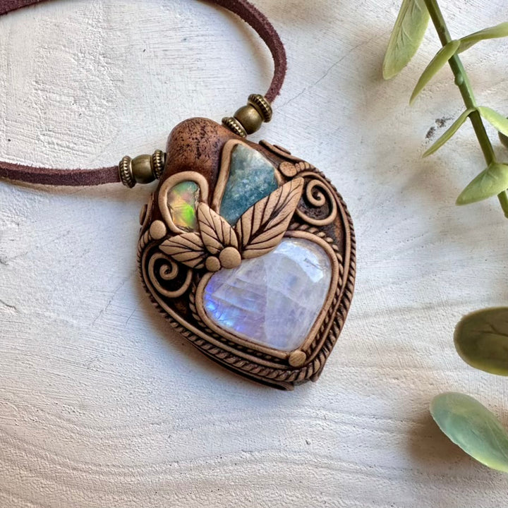 Spiritual gemstone necklace featuring rainbow moonstone aquamarine and opal