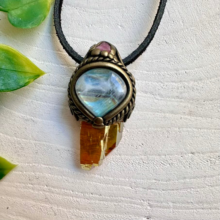 Sunset Aura Quartz crystal pendant paired with Rainbow Moonstone and Spinel