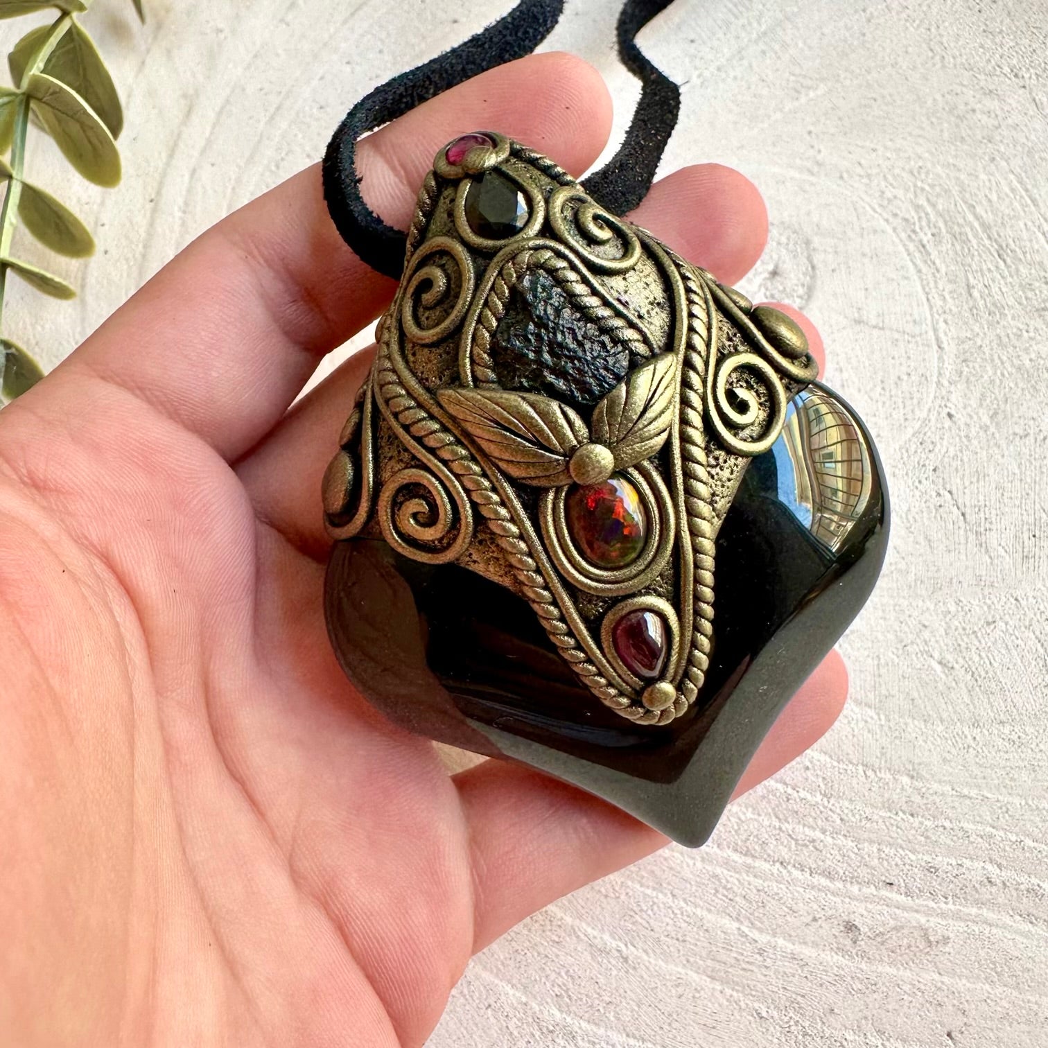 Spiritual crystal talisman necklace crafted with Rainbow Obsidian and genuine natural crystals.