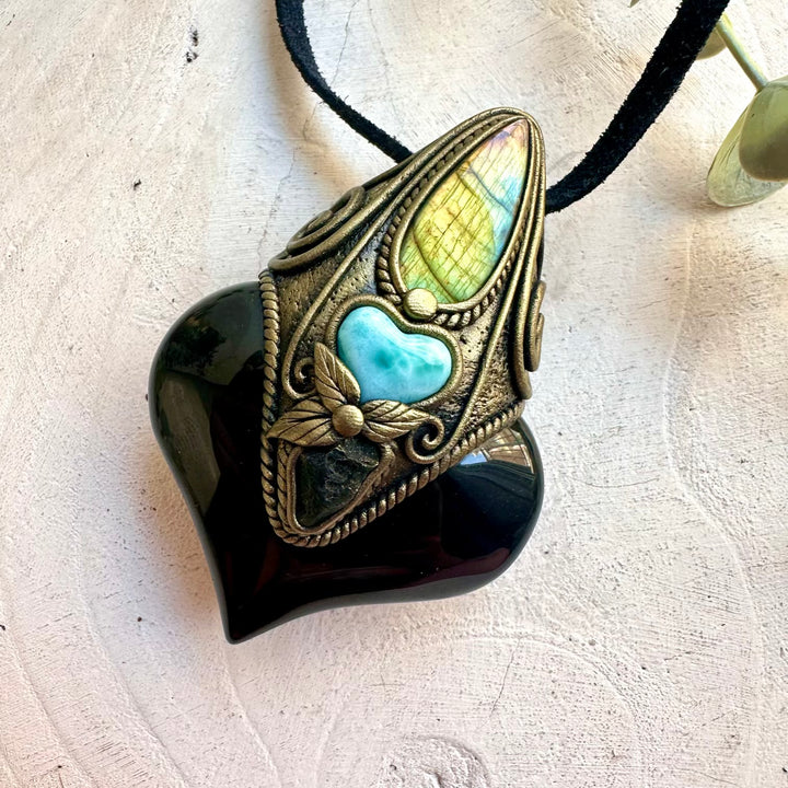 Unique gemstone pendant combining Rainbow Obsidian, Labradorite, Larimar and Moldavite.