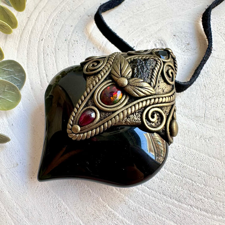 Handmade crystal jewelry featuring Rainbow Obsidian, Moldavite and Black Ethiopian Opal.