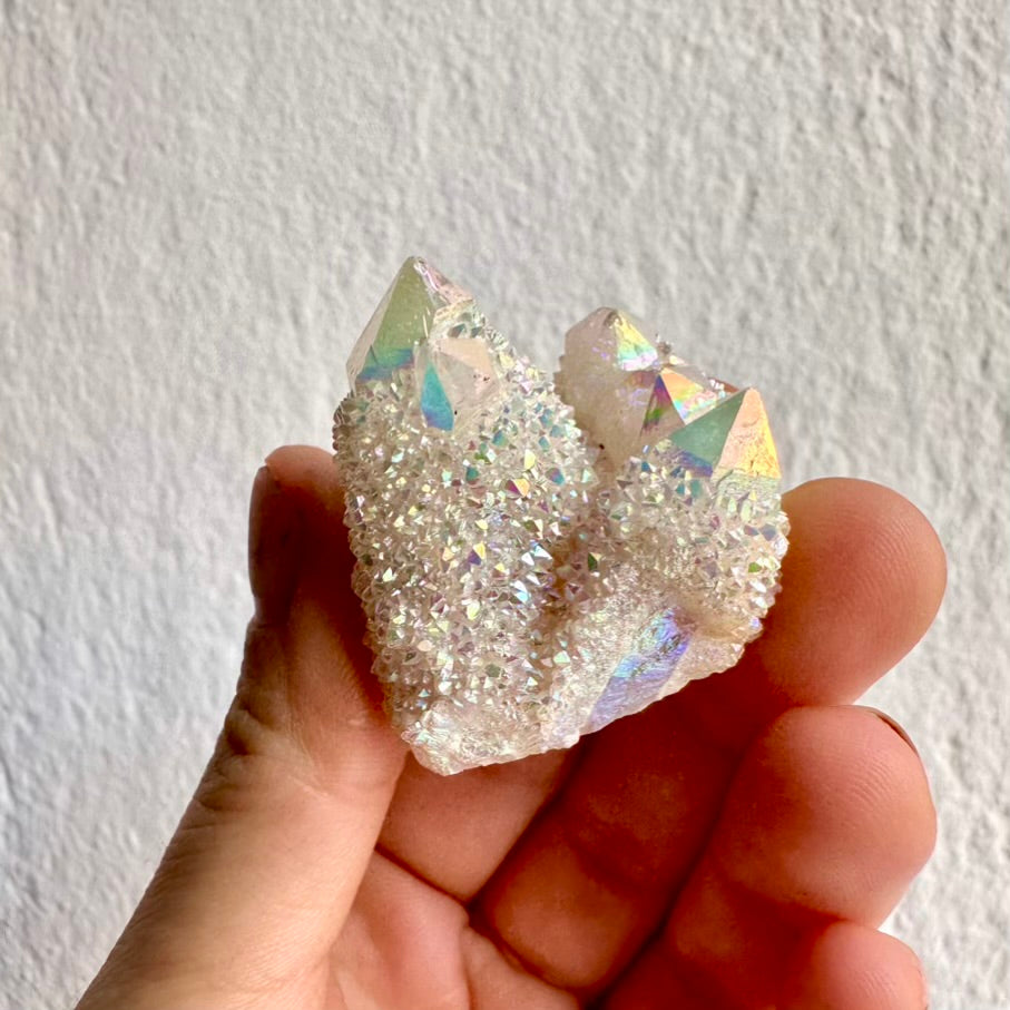Rare Angel Aura Quartz crystal cluster with iridescent rainbow sheen